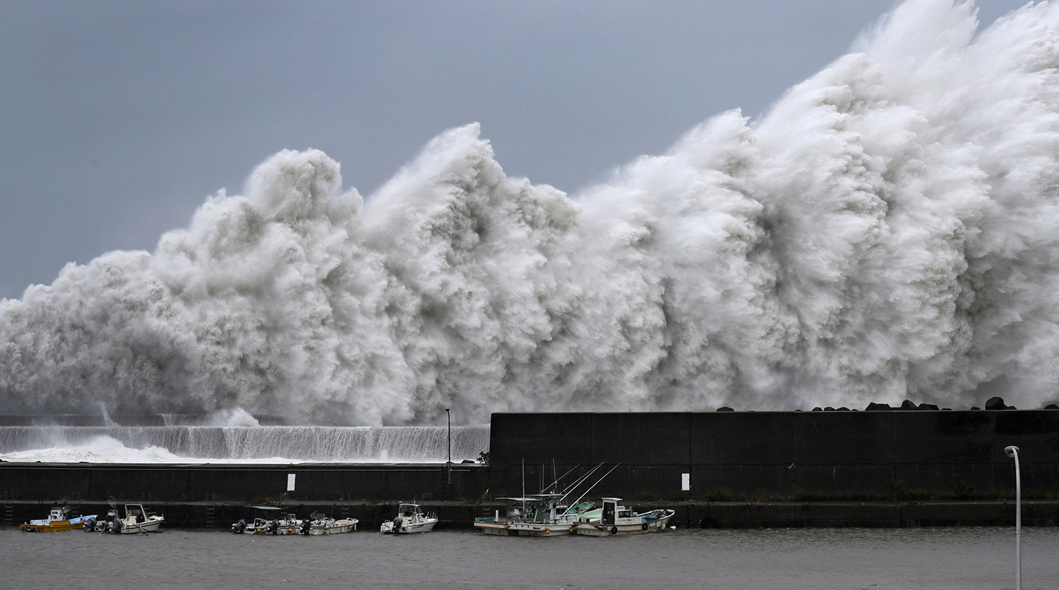 High waves triggered by Typhoon Jebi are seen at a fishing port in Aki